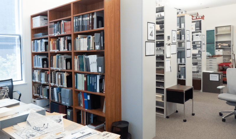 A view of the archives, showing shelves filled with books and boxes